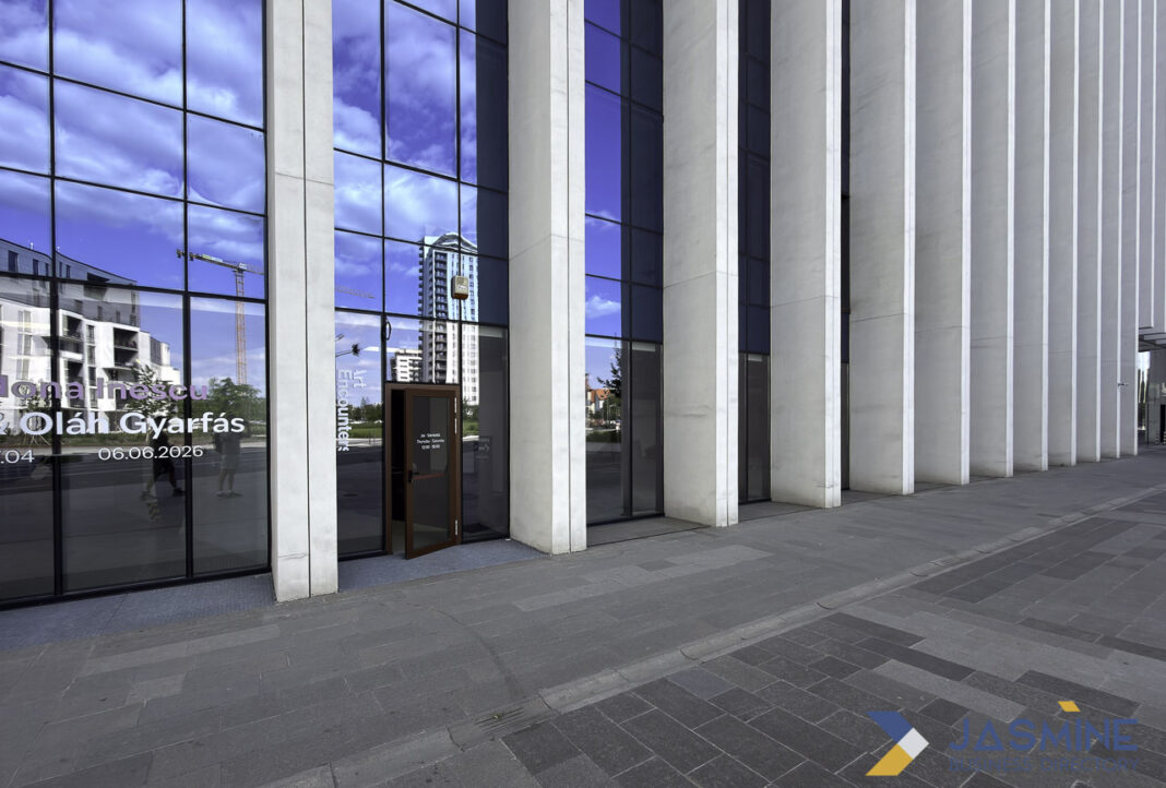 Modern professional office entrance exemplifies contemporary legal and business infrastructure Modern glass and concrete office building entrance with reflective facade, representing contemporary professional and legal business infrastructure in urban commercial districts.